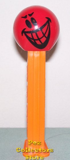 (image for) Mischevious Funky Face Pez on Orange Stem Loose - Click Image to Close