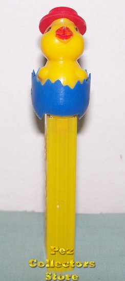 (image for) Dark Yellow Chick in Blue Soft Shell Egg Pez on Yellow NF No Patent Austria