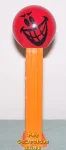 (image for) Mischevious Funky Face Pez on Orange Stem Loose