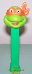 (image for) TMNT Happy Michaelangelo Orange mask on Green Stem Pez