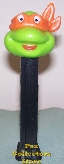 (image for) TMNT Happy Michaelangelo Orange mask on Black Stem Pez - Click Image to Close