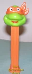 (image for) TMNT Happy Michaelangelo Orange mask on Orange Stem Pez