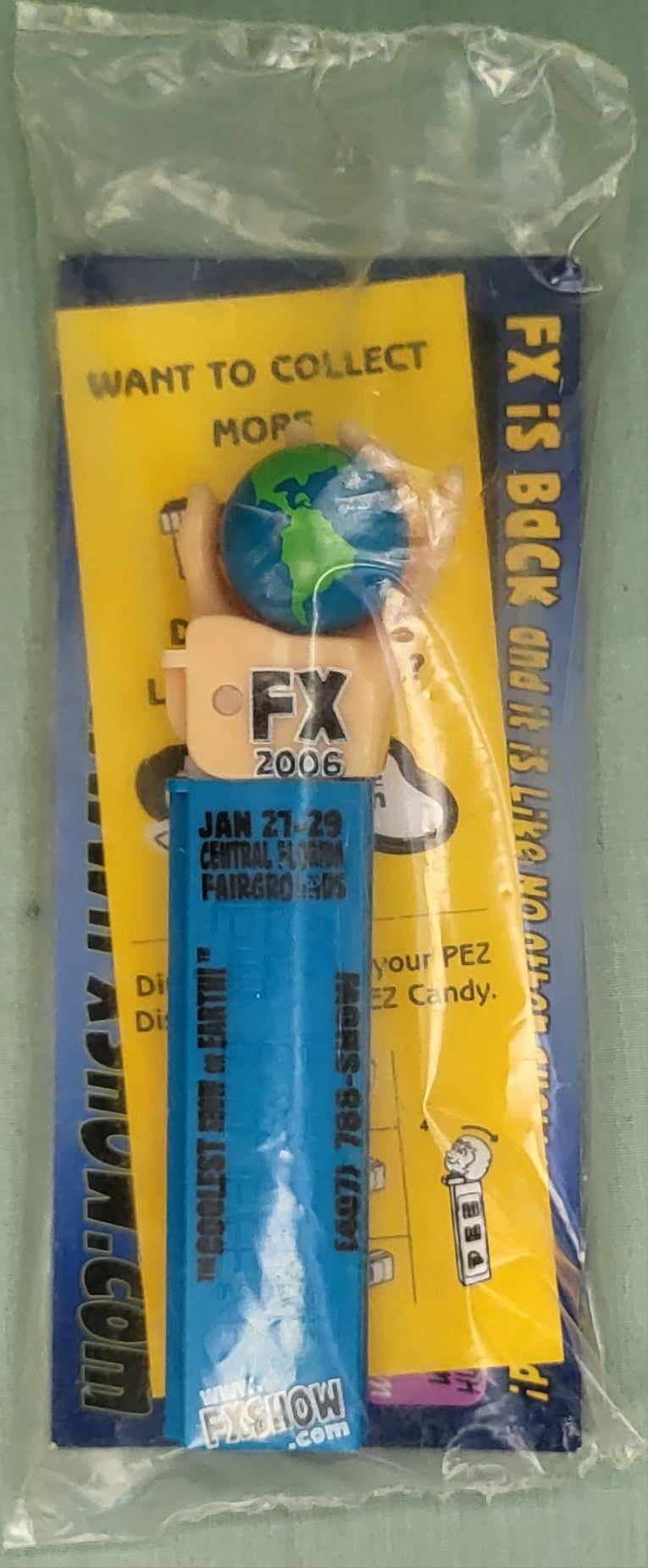 2006 FX Show Earth in Hand PEZ Black print 2 day pass Pez with